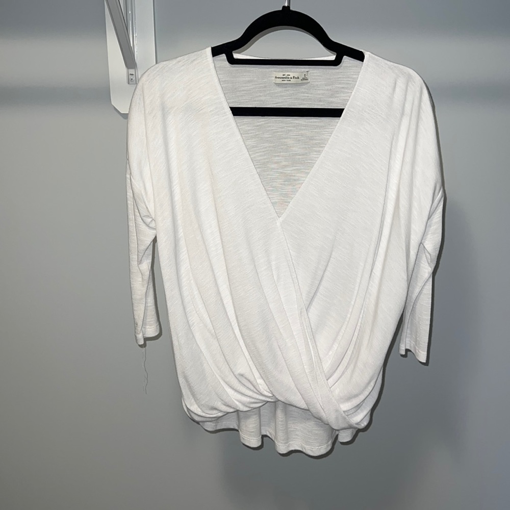 3/4 length sleeve white shirt with fun wrap around front detailing